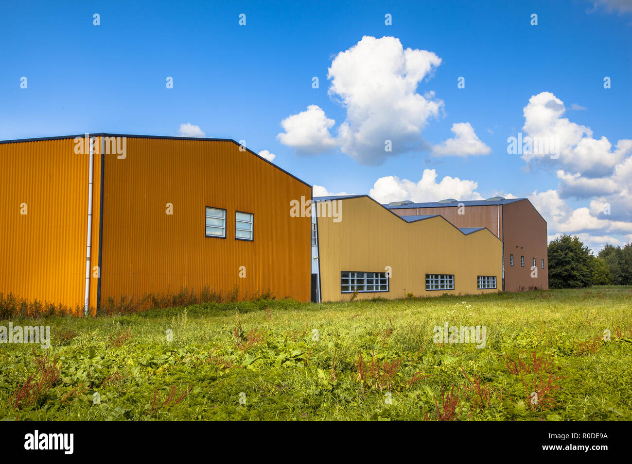 Colorful new contemporary industrial building in a commercial area under development Stock Photo