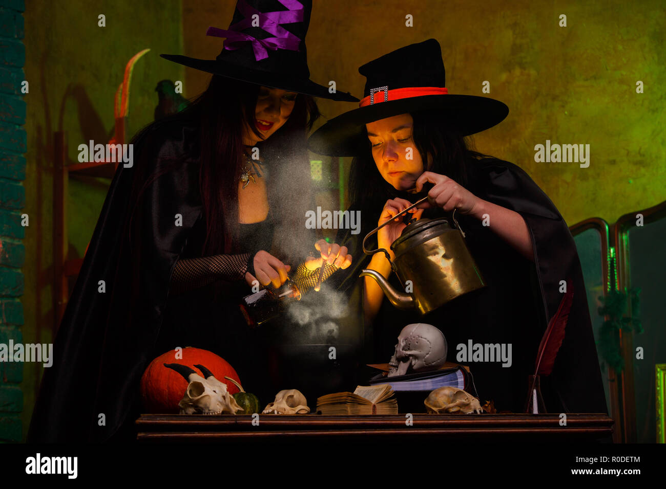 Picture of witches with pot of magical poison and steam Stock Photo