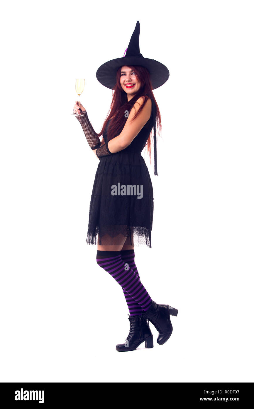 Picture of witch brunette with wine glass with wine in black dress Stock Photo