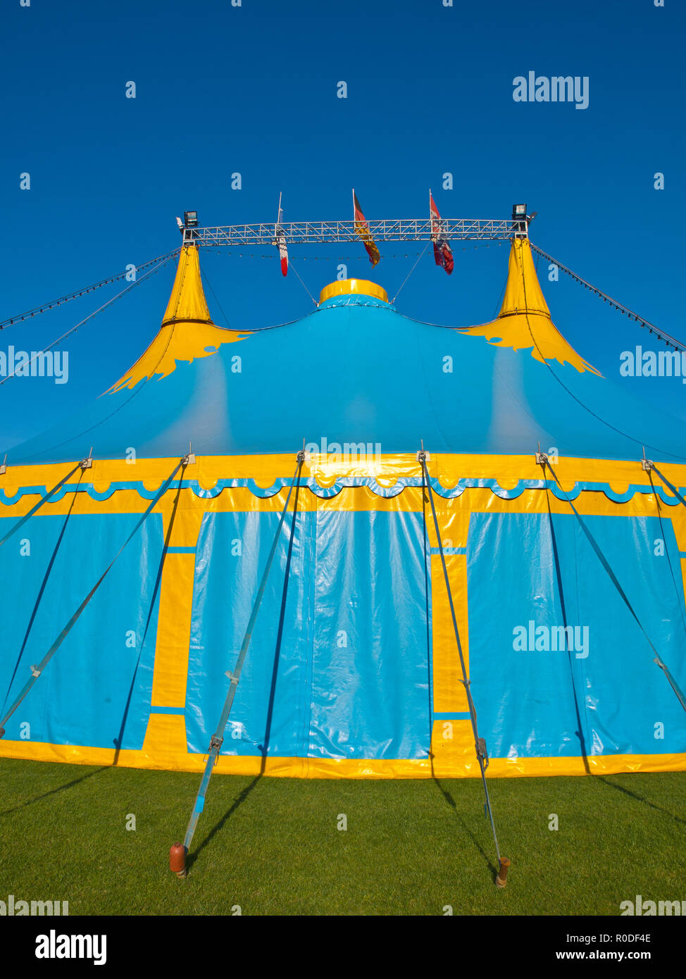 Blue and yellow big top circus tent portrait Stock Photo - Alamy