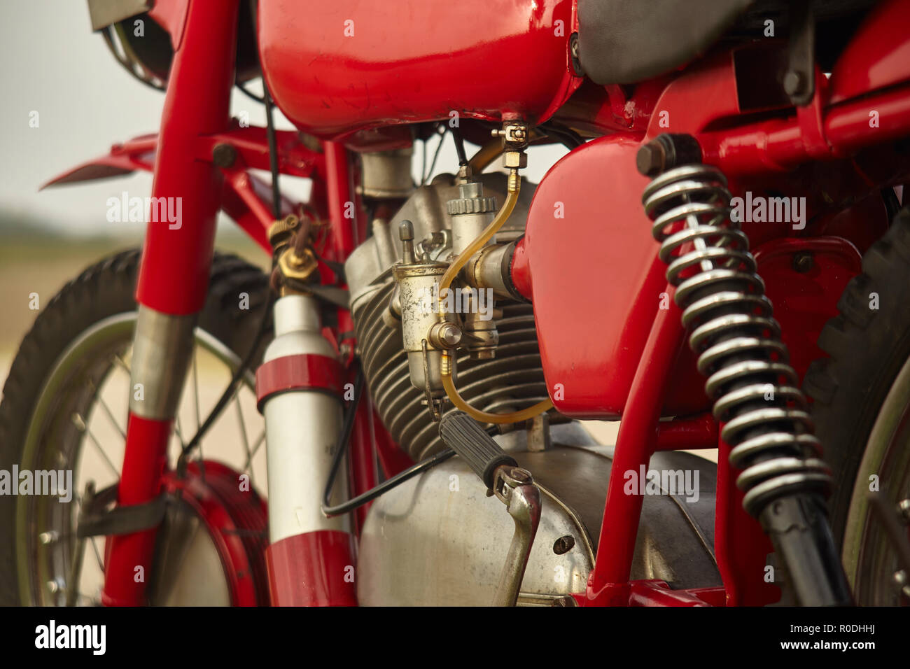 Engine of a very old vintage motorcycle with visible details of the