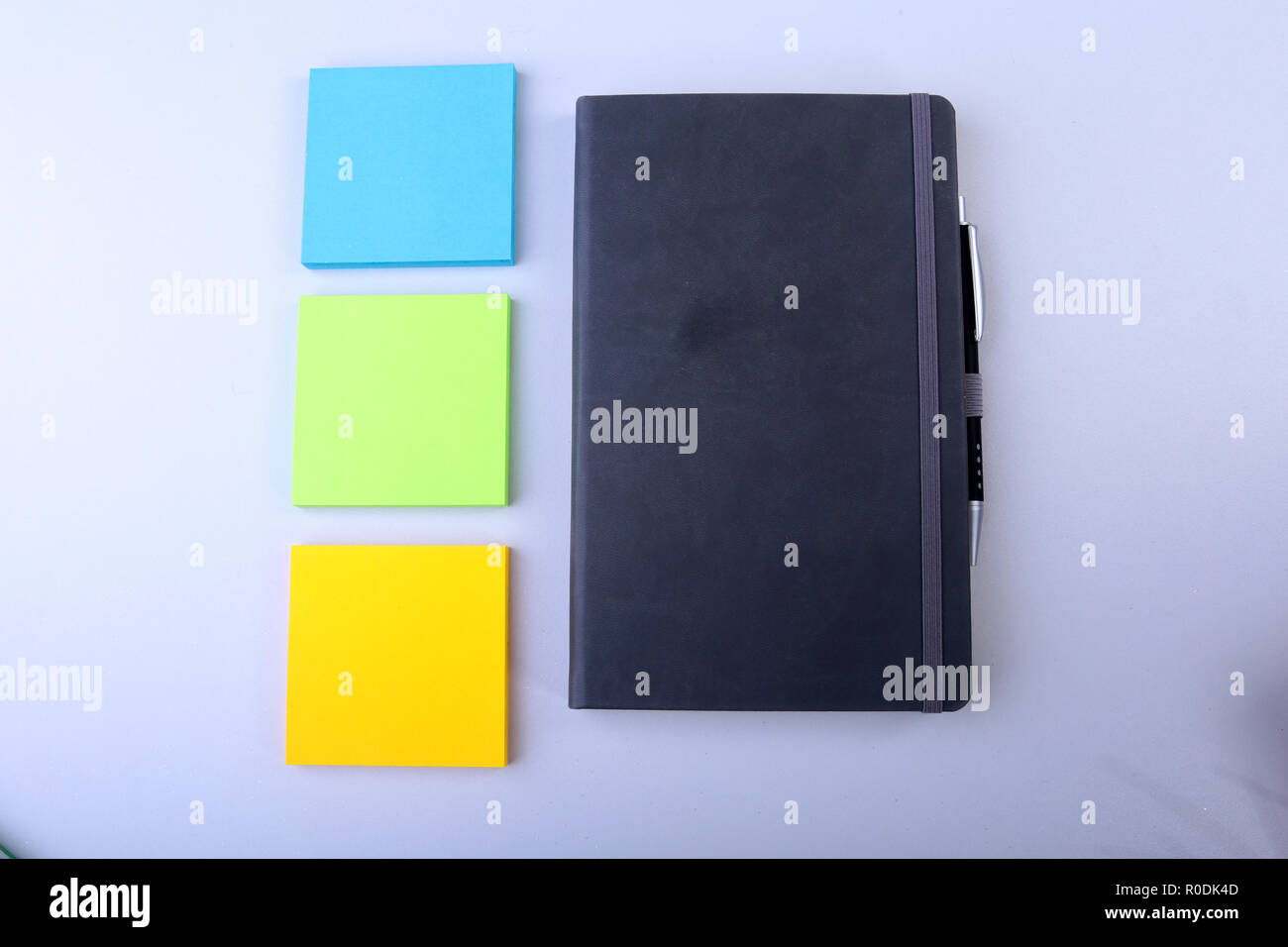 White notepad with colorful sticky reminder notes Stock Photo Alamy