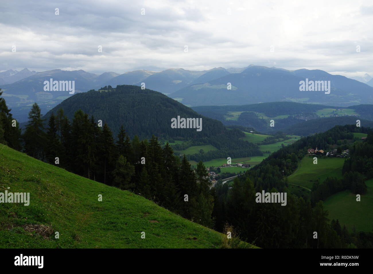 Alpine mountain landscape with coniferous forest Stock Photo