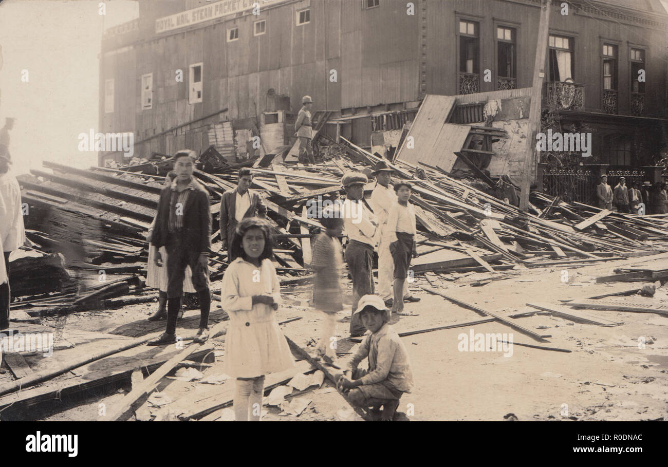 Vintage Photographic Postcard Showing Destruction on a Building Which Had Been Next To a Royal Mail Steam Packet Company Building. Location Unknown But Possibly From South America. Stock Photo