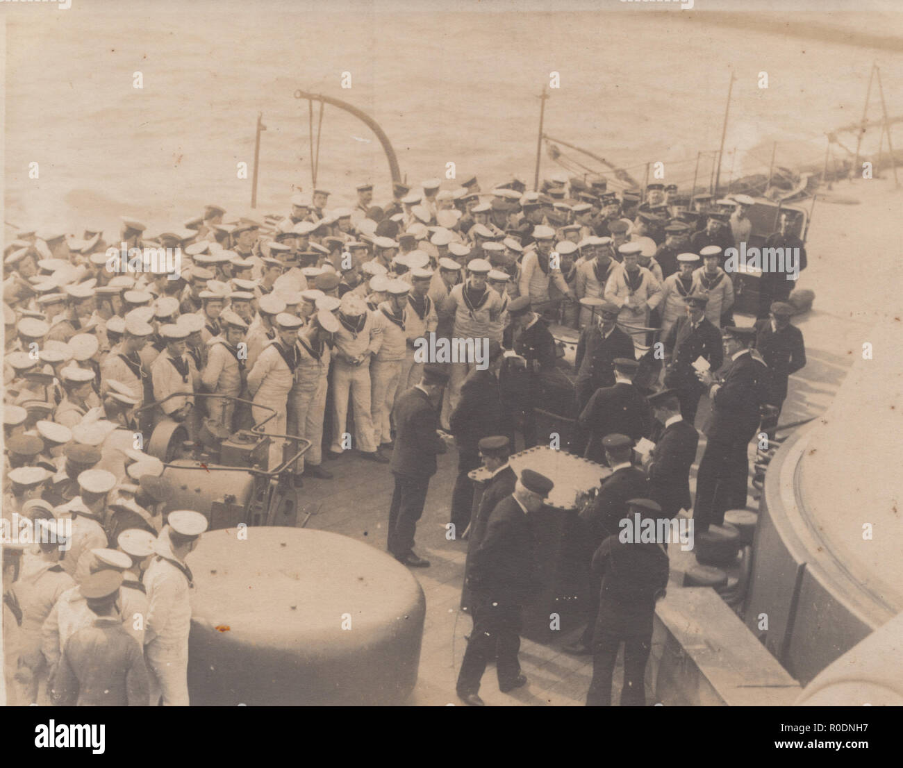 Vintage Photographic Postcard Showing The Officers and Sailors of H.M.S.Orion Stock Photo