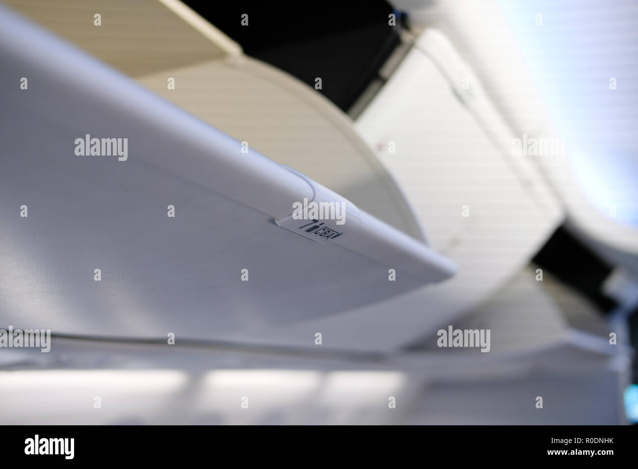 Airplane overhead compartment hires stock photography and images Alamy