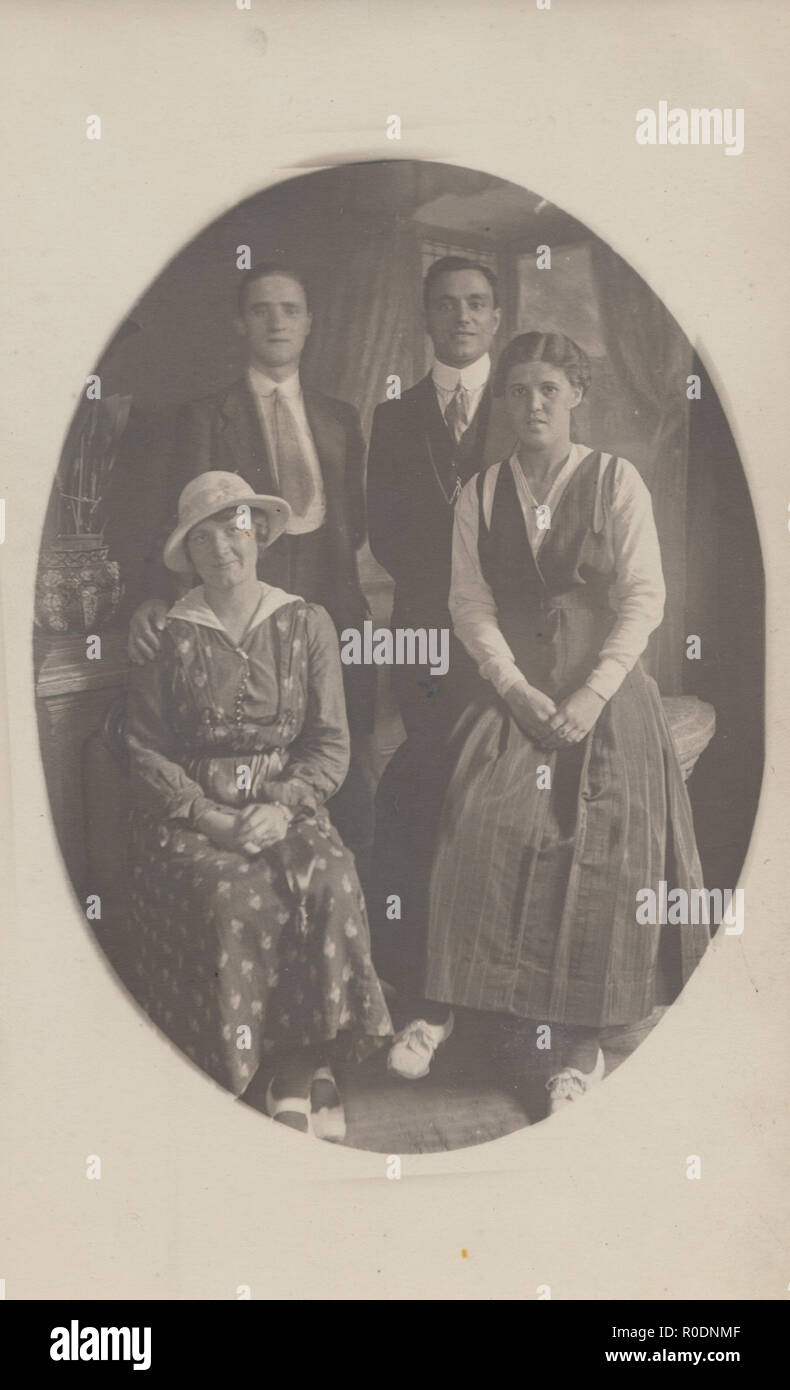 Vintage Photographic Postcard of a Family Group. Stock Photo