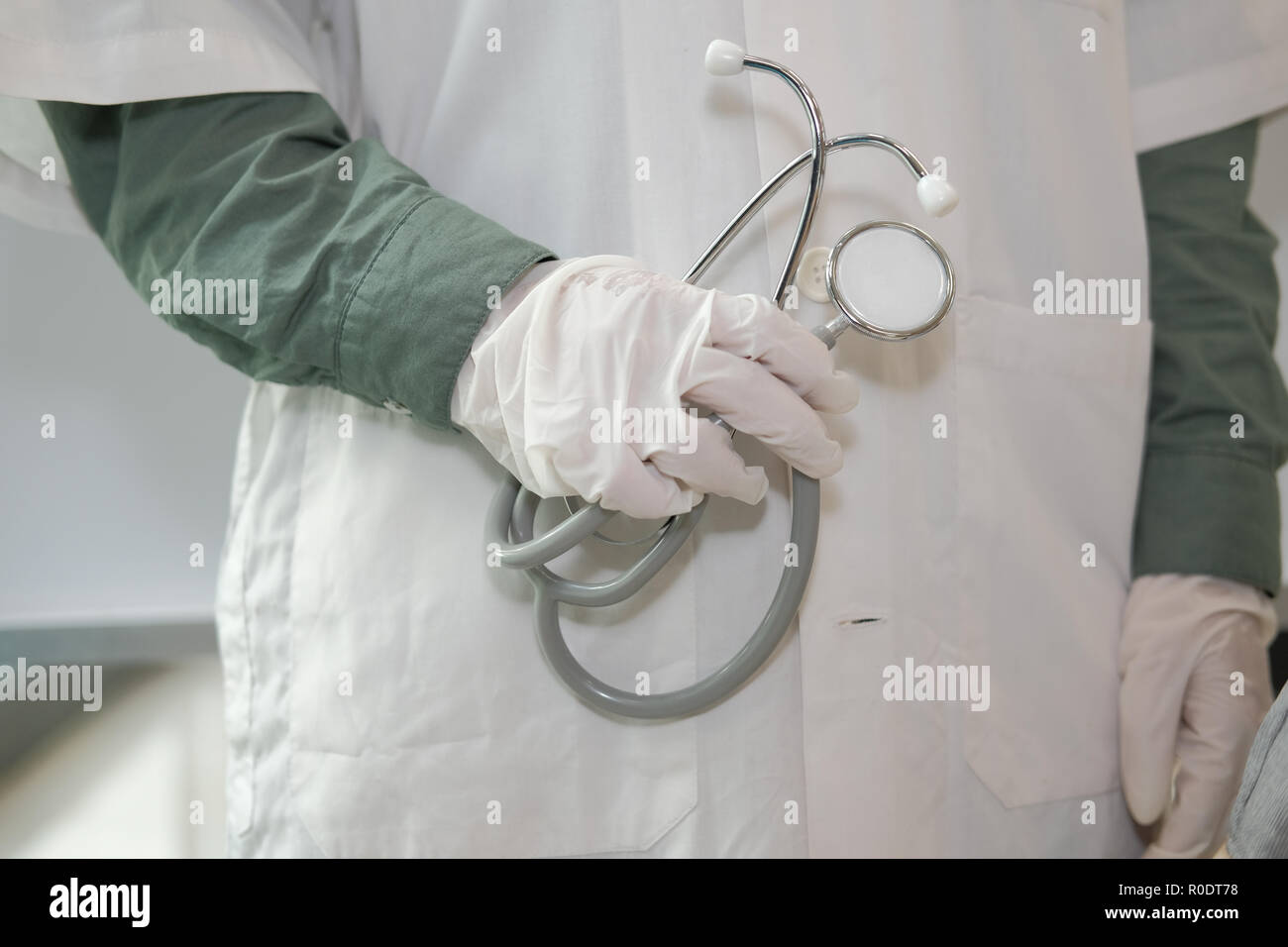 physician doctor medical practitioner with stethoscope to auscultate