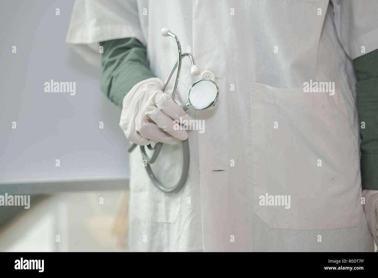 physician doctor medical practitioner with stethoscope to auscultate