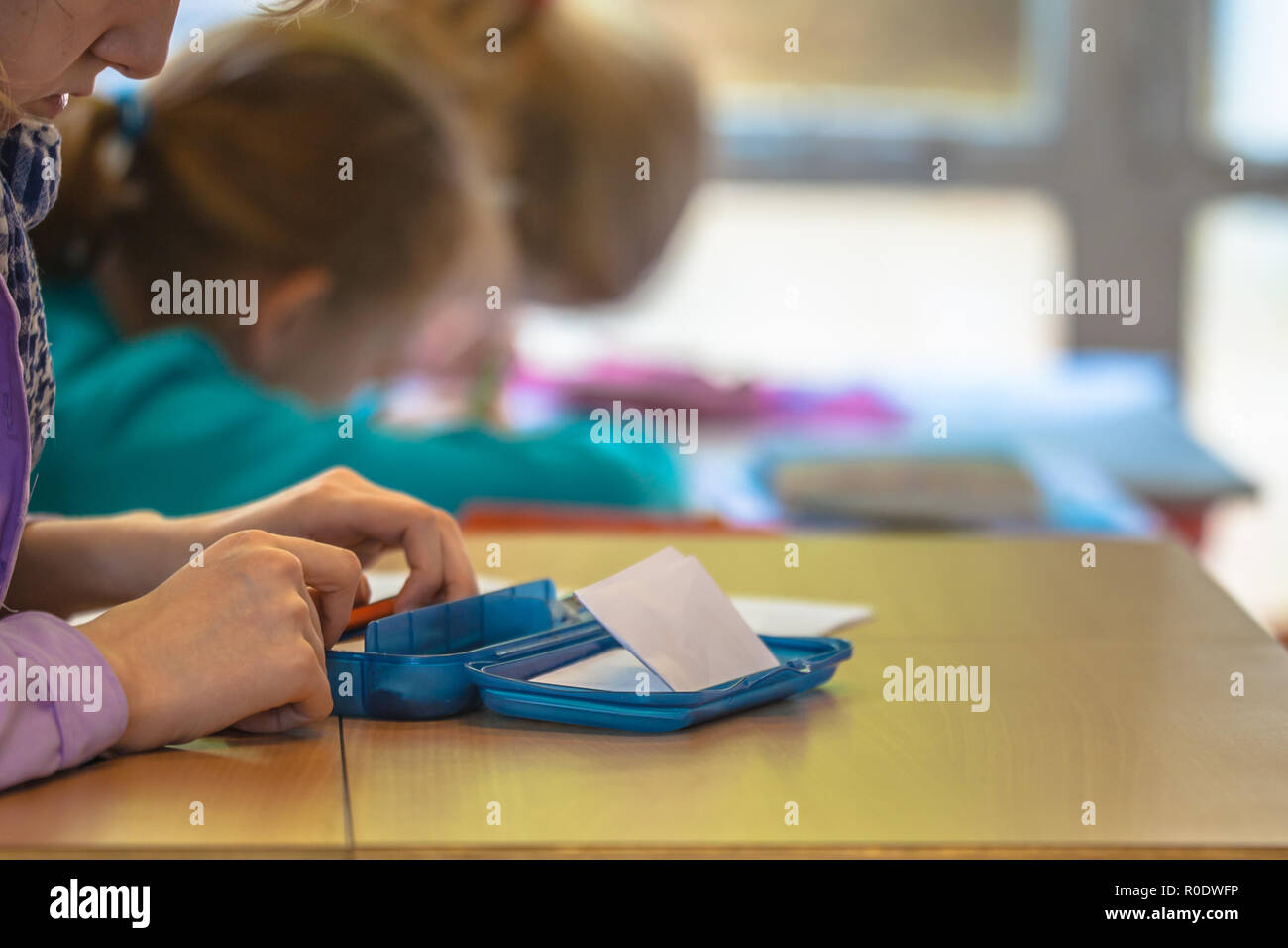 Student Writing in Notebook during Lesson on School Stock Photo Alamy