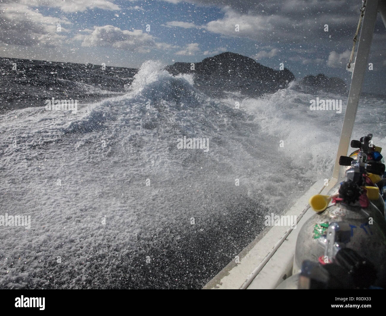 Big Wave Collapses on a Diving Ship Stock Photo