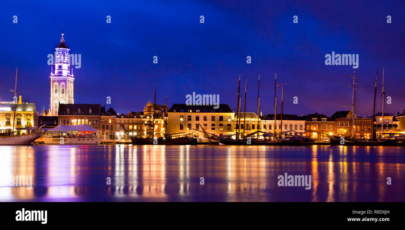 Old Wooden Sailing Ships on the Riverside in the Historical City of Kampen, Overijssel, Netherlands by Night Stock Photo