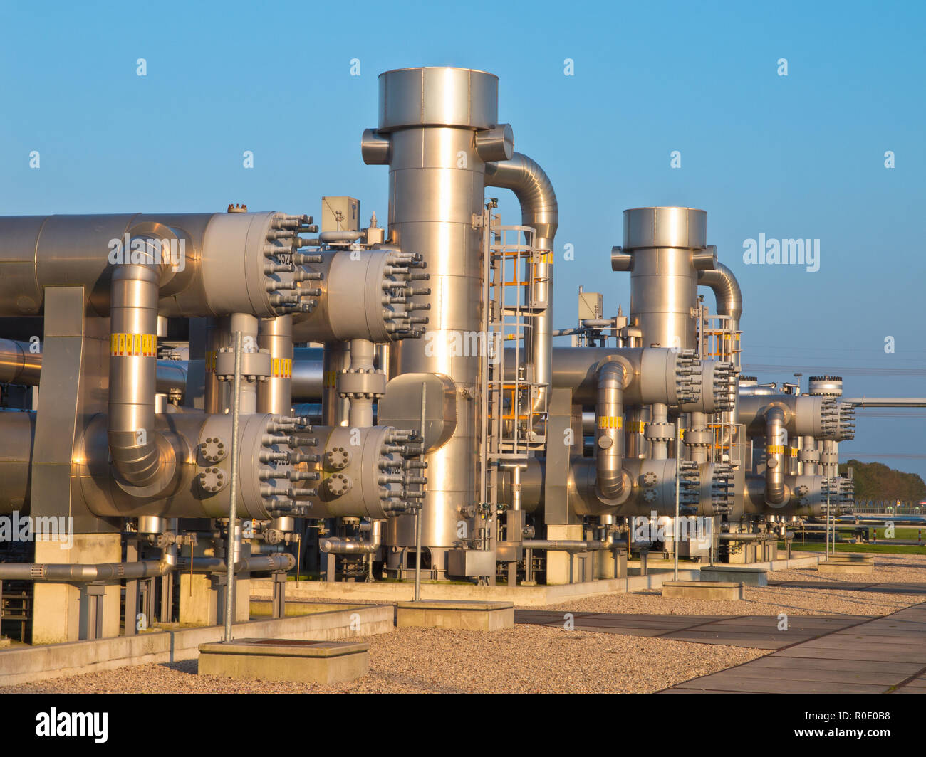 natural gas processing site during sunset Stock Photo