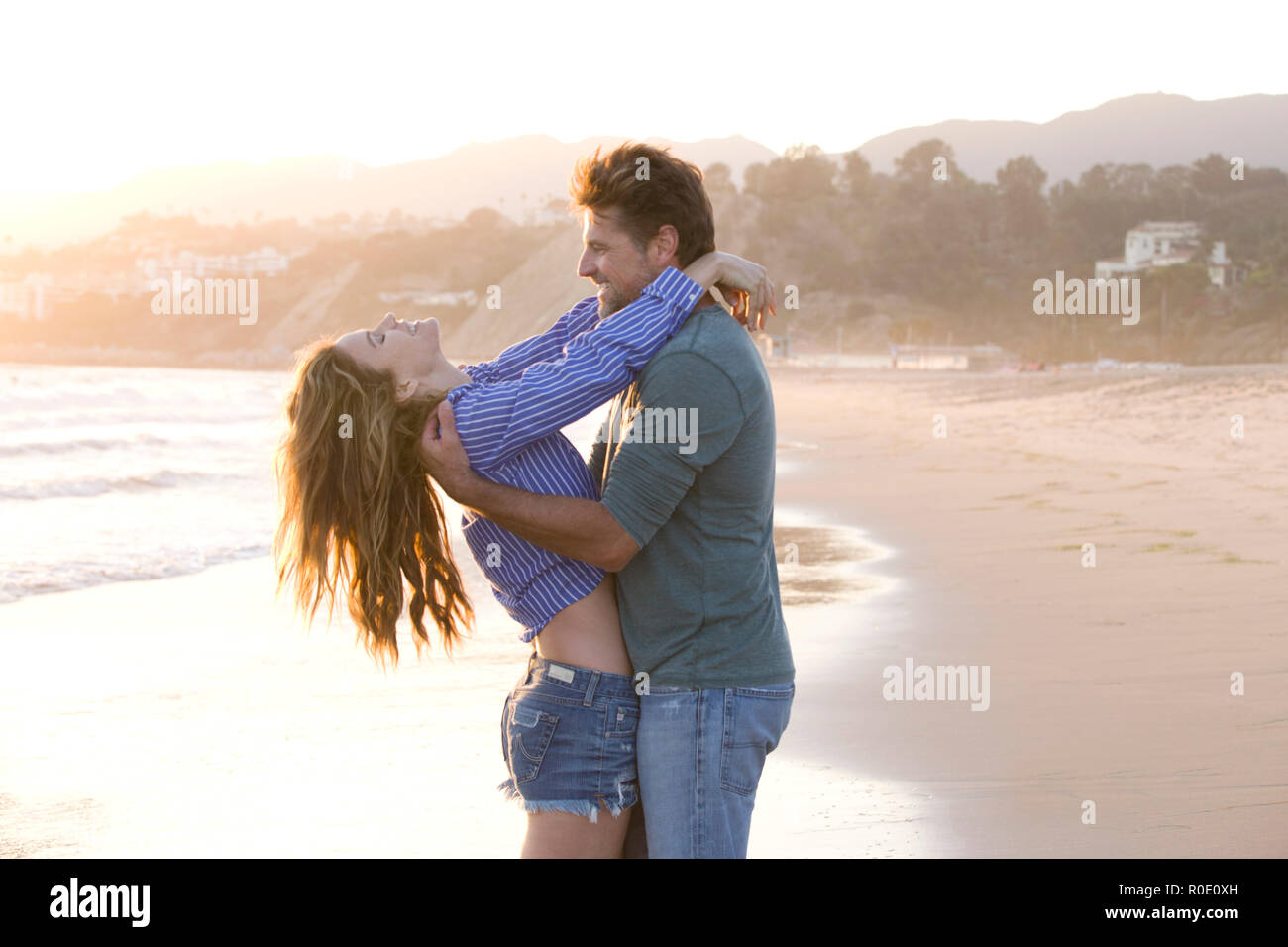 Carefree Mid-Adult Couple at Beach Stock Photo
