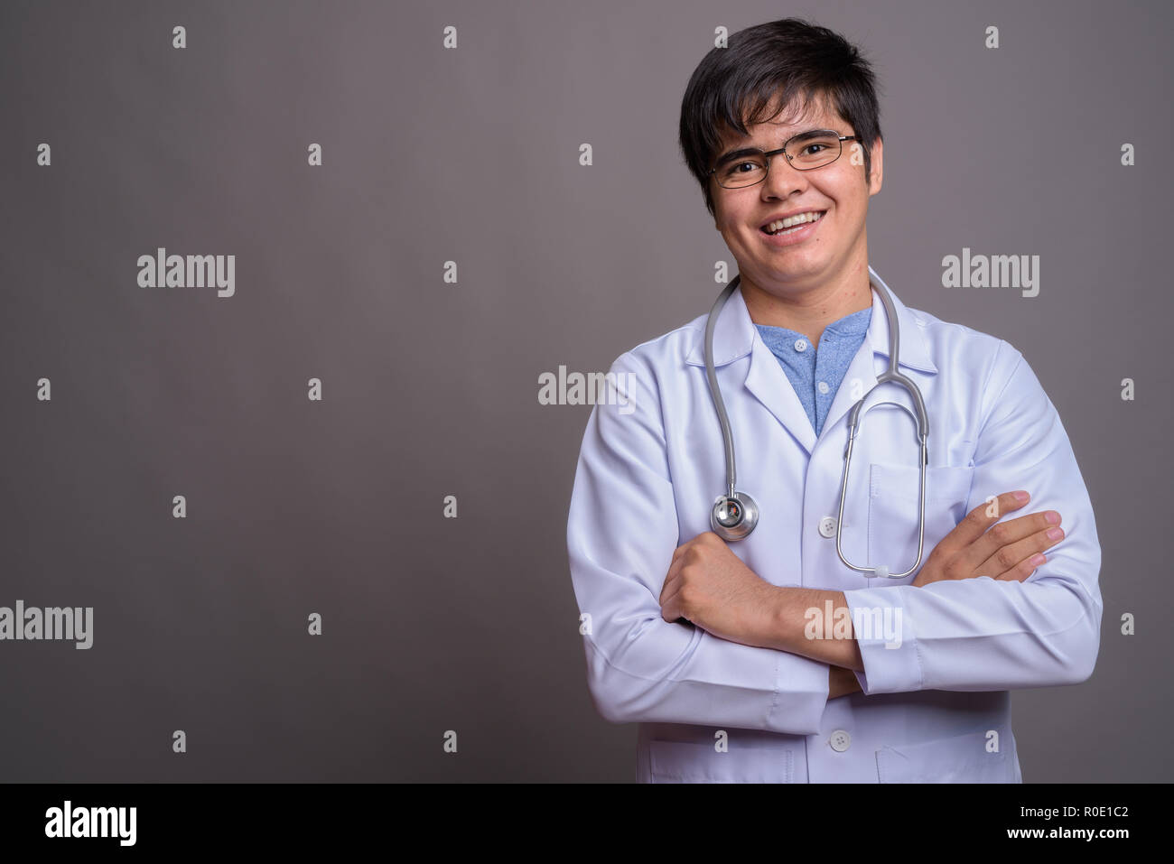 Happy persian man doctor arms hi-res stock photography and images - Alamy