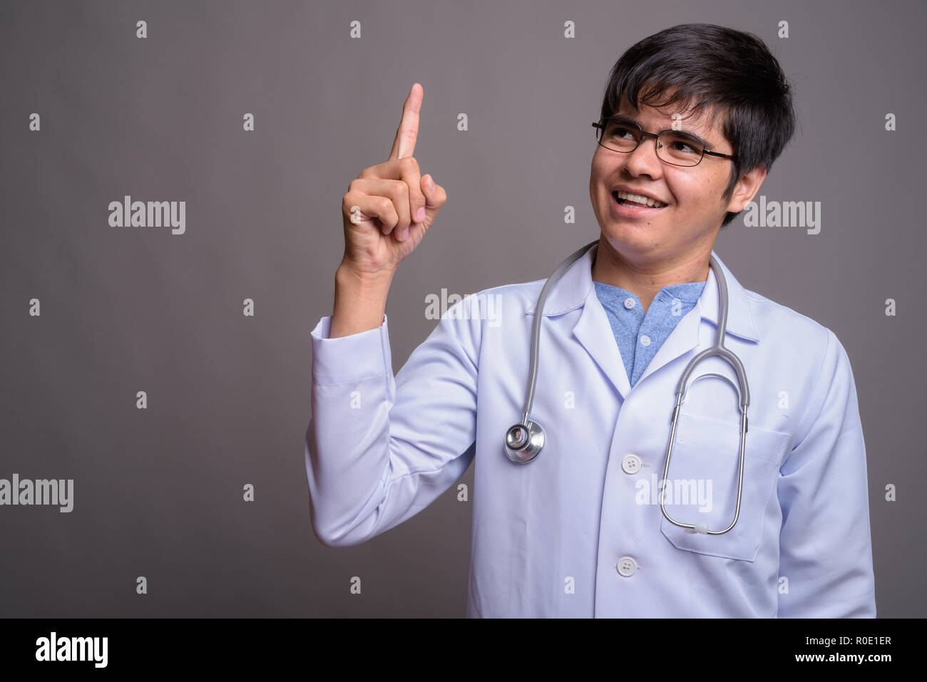 Happy asian man doctor thinking hi-res stock photography and images - Alamy