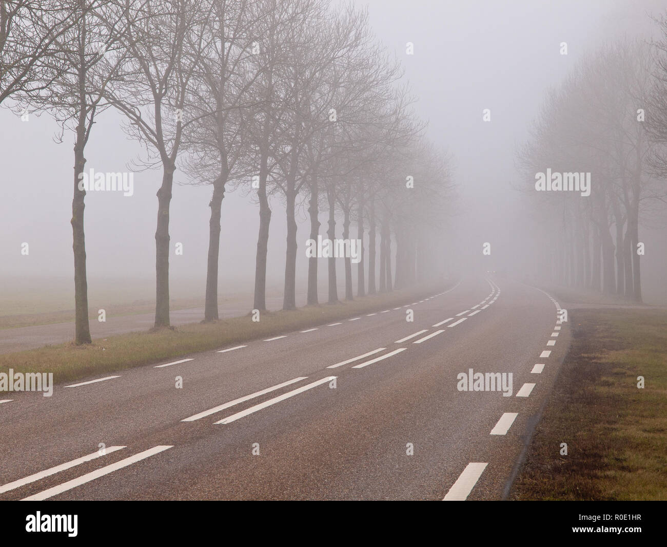 Misty road hi-res stock photography and images - Alamy