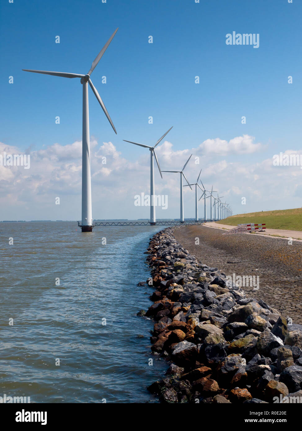 Row of wind turbines along the coast Stock Photo - Alamy