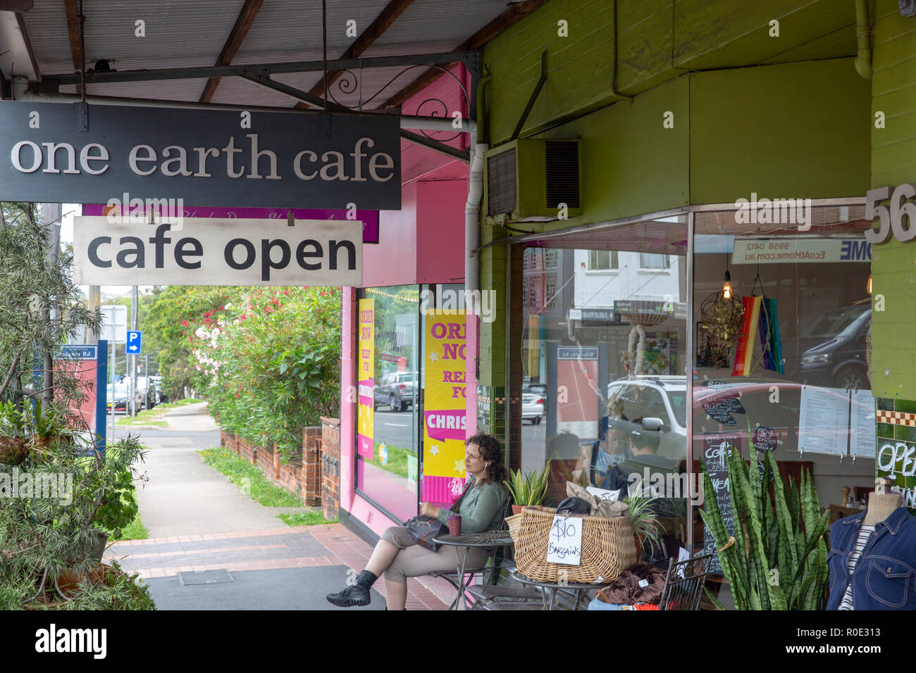Lady sitting outside One earth cafe in Willoughby,Sydney,Australia Stock Photo