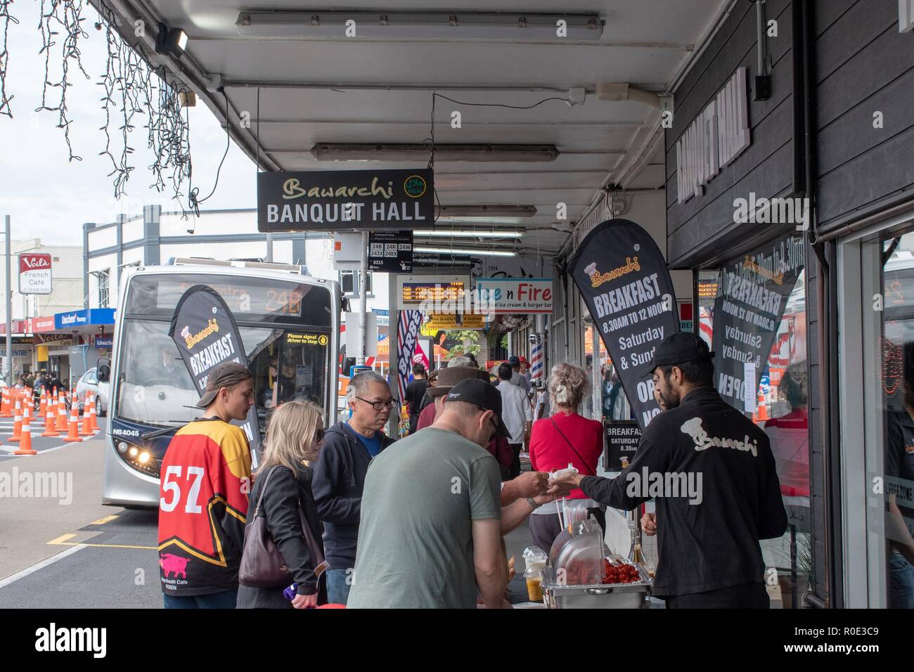 Visitors at the Sandringham Street Festival sampling some street food Stock Photo Alamy