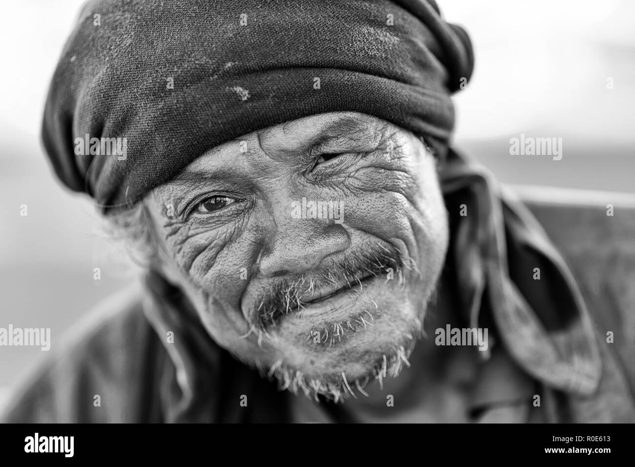 TRANG, THAILAND, JANUARY 11, 2016 : A homeless Thai man is posing in the street of Trang, Thailand Stock Photo