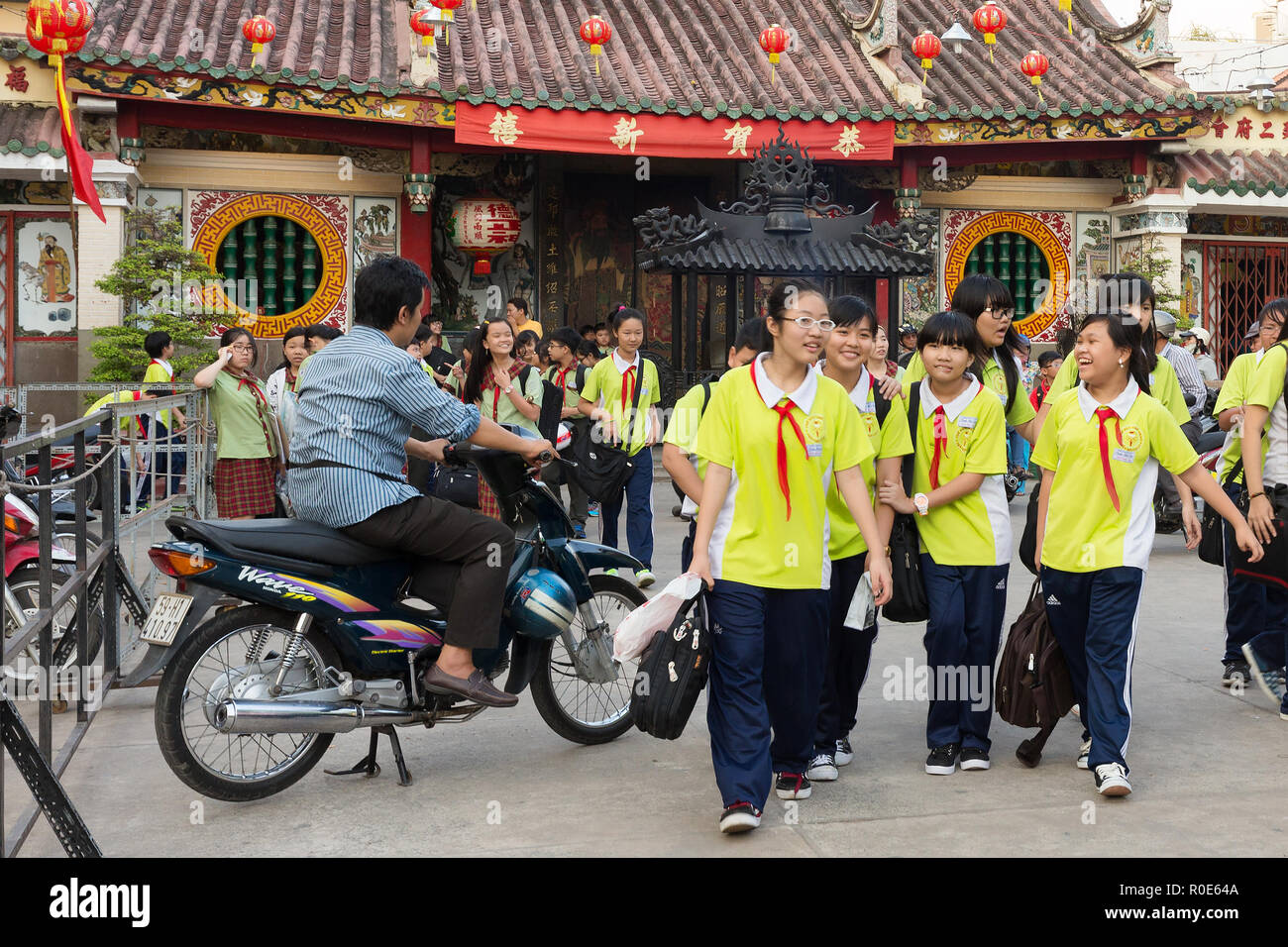HO CHI MINH, VIETNAM, FEBRUARY 24 , 2015: Vietnamese students in Chinese language are leaving school at the Ong Bon Pagoda, in Chinatown, district 5 o Stock Photo