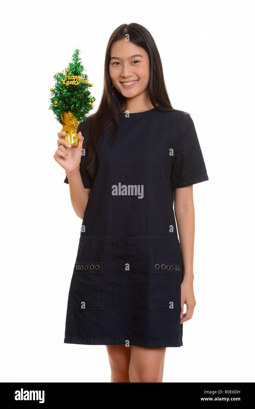 Young happy Asian teenage girl smiling and holding Happy New Yea Stock ...
