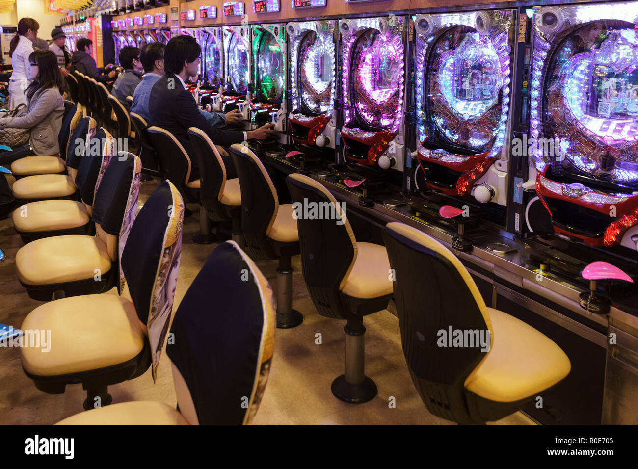 KYOTO, JAPAN, NOVEMBER 15, 2011: Some customers are gambling in a Pachinko hall, traditional Japanese Game in Kyoto, Japan Stock Photo