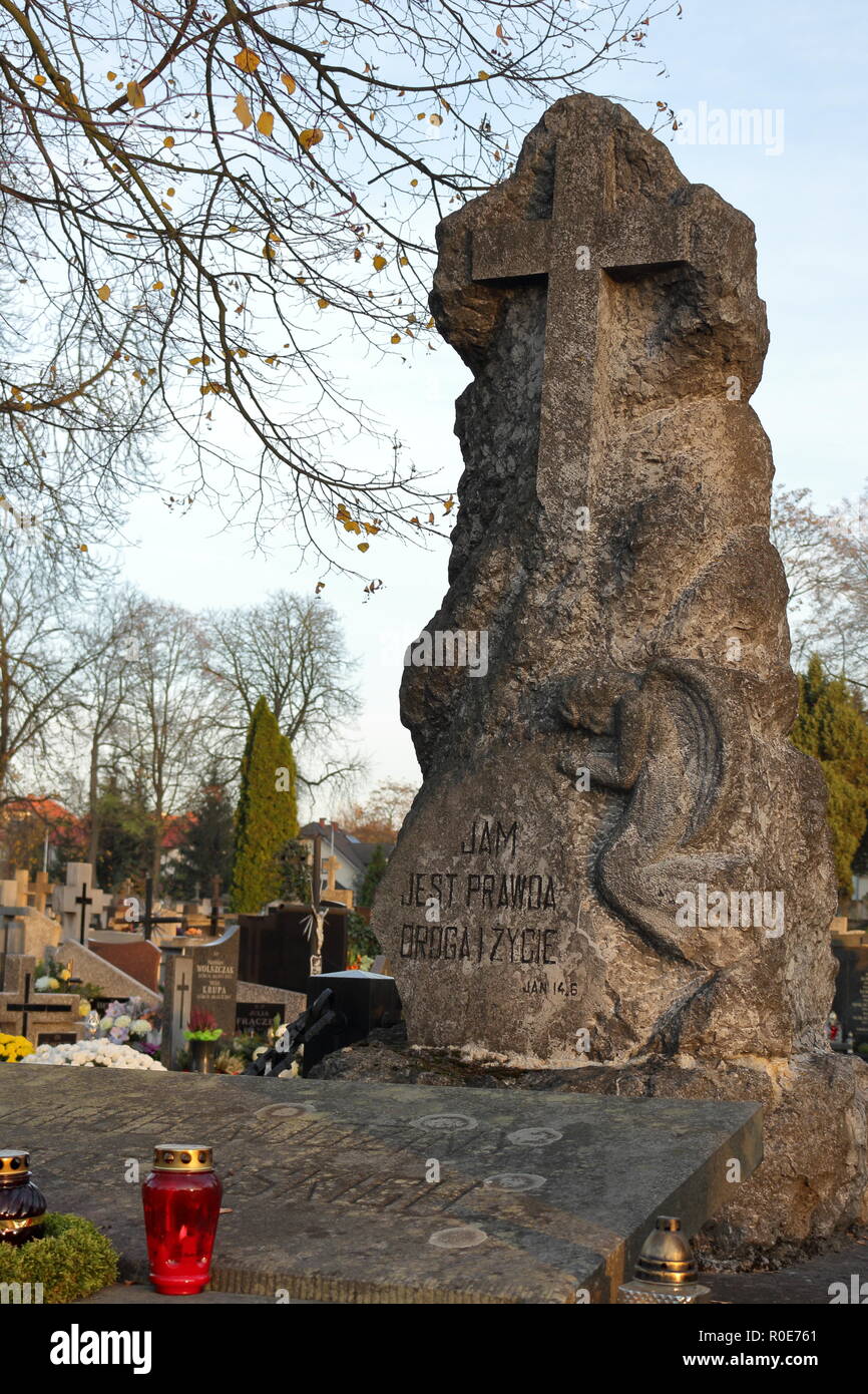All Saints' Day. Sculpture tombstone in old cemetery in Poland Stock Photo