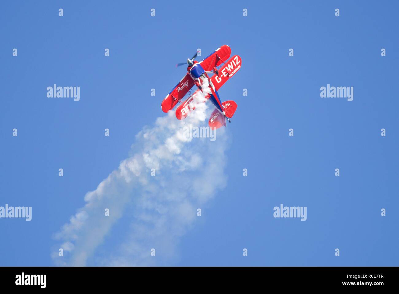 Rich Goodwin performs high energy aerobatic manoeuvres in his Super Pitts S2S (G-EWIZ) Muscle biplane at the 2018 Bournemouth Air Festival Stock Photo