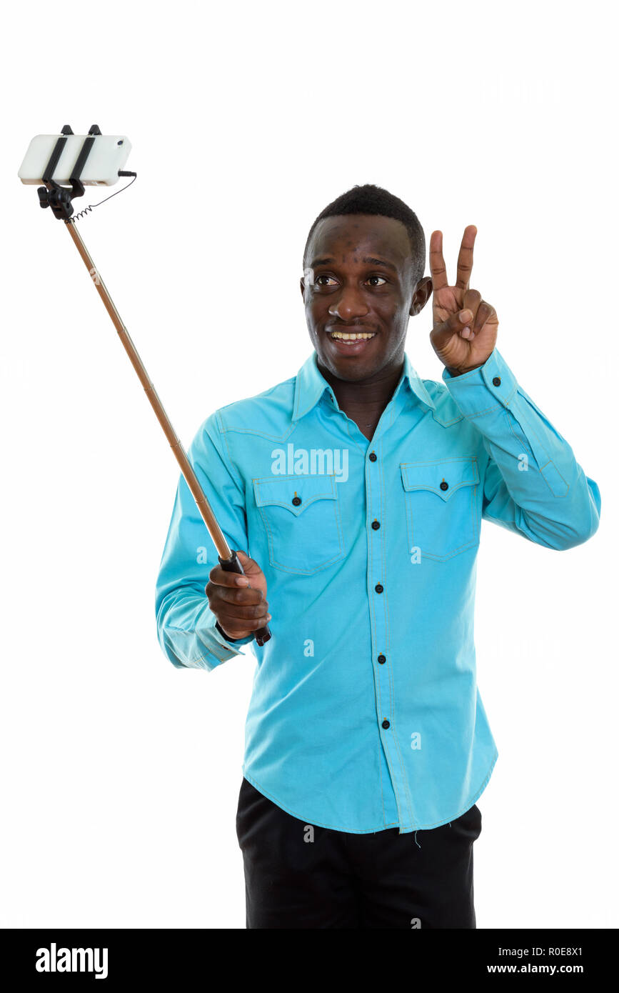Studio shot of young happy black African man smiling and giving Stock ...