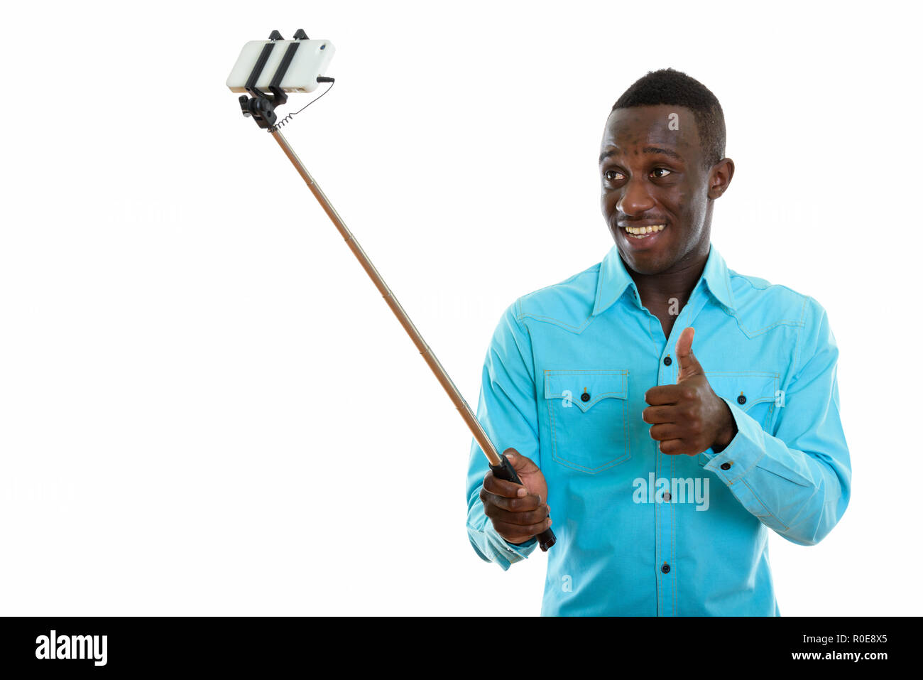 Studio shot of young happy black African man smiling and giving Stock ...