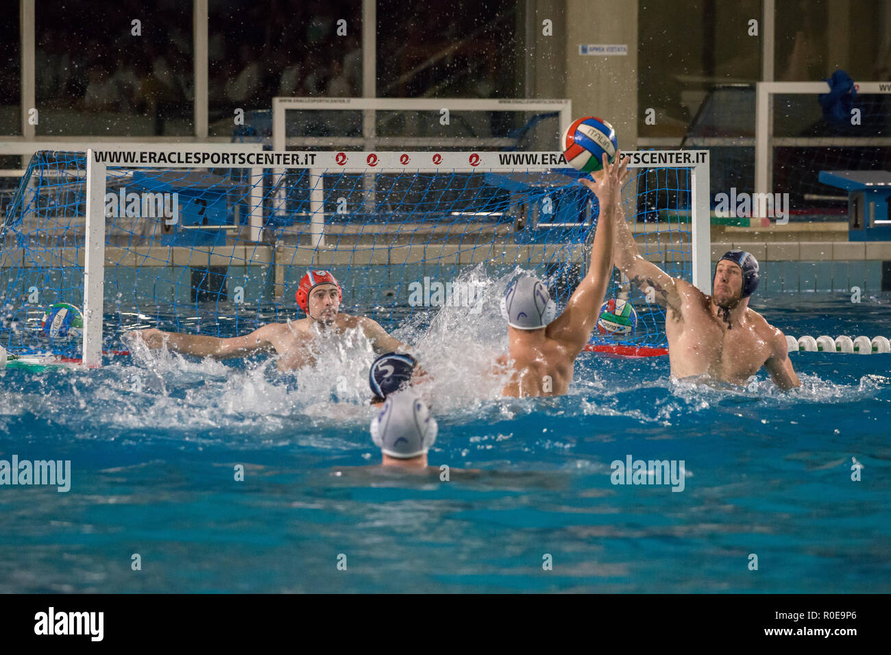Five players during attack actions - A series of shots depicting water polo players,.Game actions, attack, defense and goal. Stock Photo