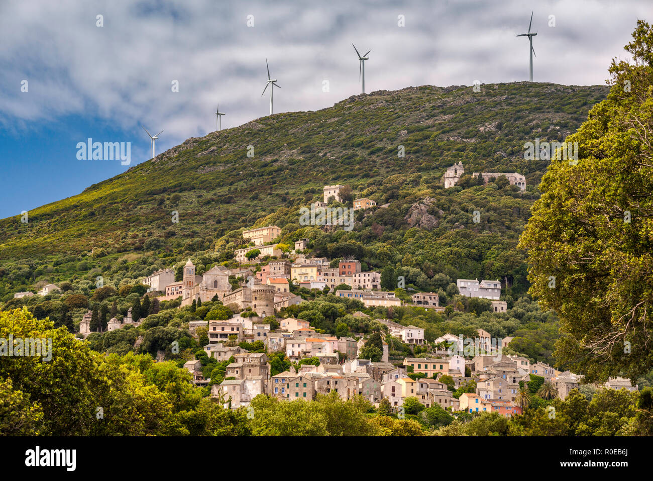 Wind turbines over village of Bettolacce, in commune of Rogliano, Cap Corse, Haute-Corse, Corsica, France Stock Photo