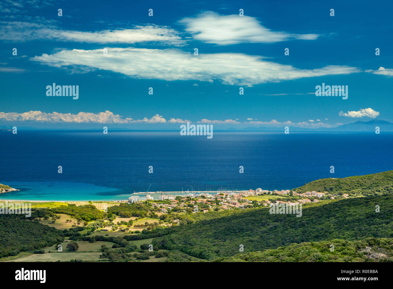 Village and marina of Macinaggio at Tyrrhenian Sea, Tuscan island of Elba  in distance, Cap Corse, Haute-Corse, Corsica, France Stock Photo - Alamy