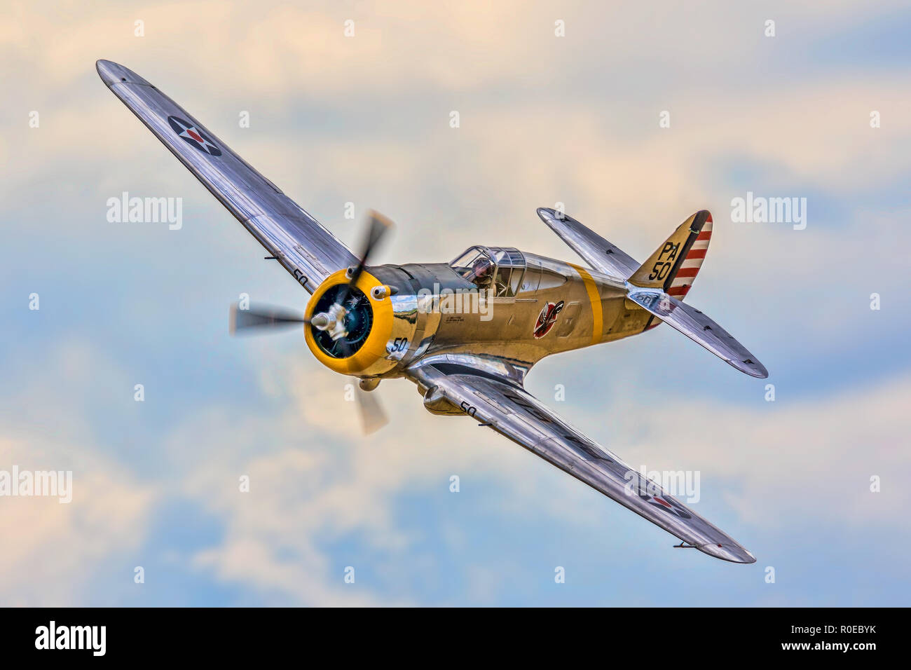The Fighter Collection's 1939 Curtiss P-36C Hawk 38-210/N80FR pictured in USAAC colours over Duxford, UK in 2015. Taken with a Canon EOS 7D MkII. Stock Photo
