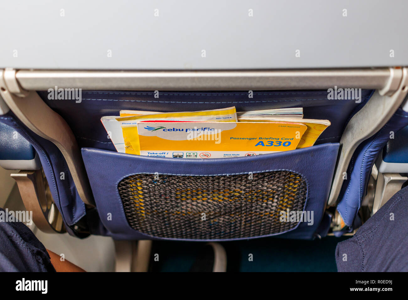 Seat Pocket Containing  Safety Card And Magazines Inside Cebu Pacific Plane Stock Photo