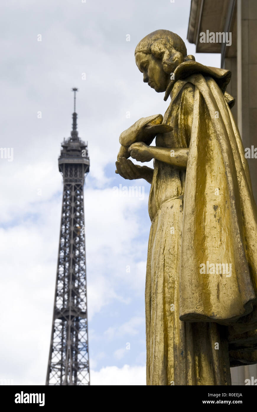 The Eiffel Tower as seen from the Place du Trocadero where gold figures stand representing the rights of man, Paris, France. Stock Photo