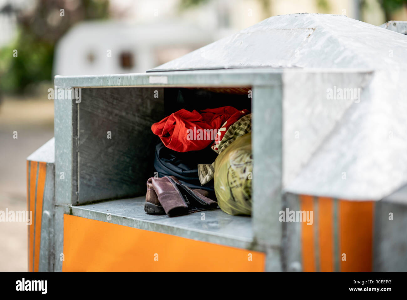 A lot of worn clothes in a container in Germany. Stock Photo