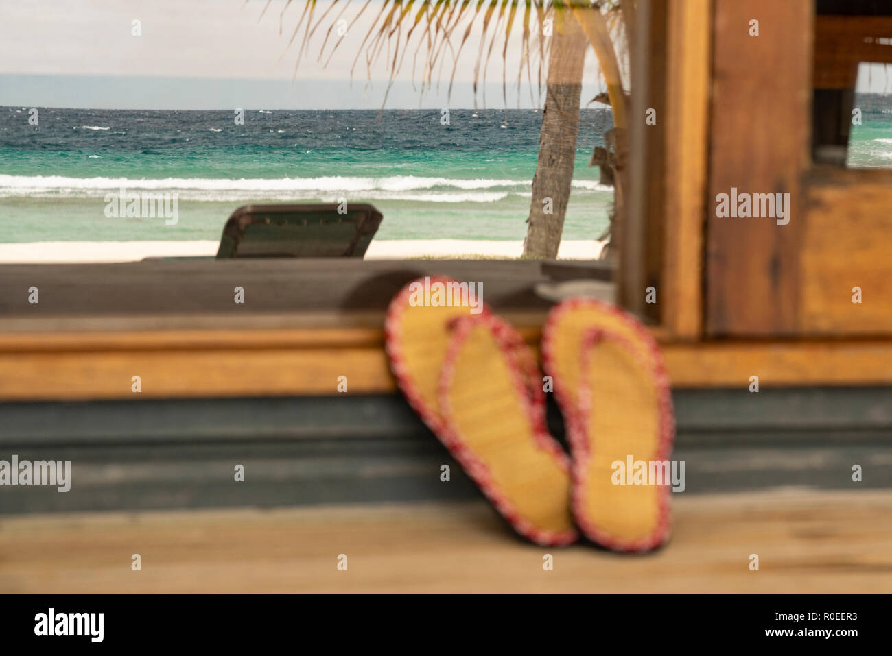 A pair of Flip Flops on a porch at the Maledives. Stock Photo