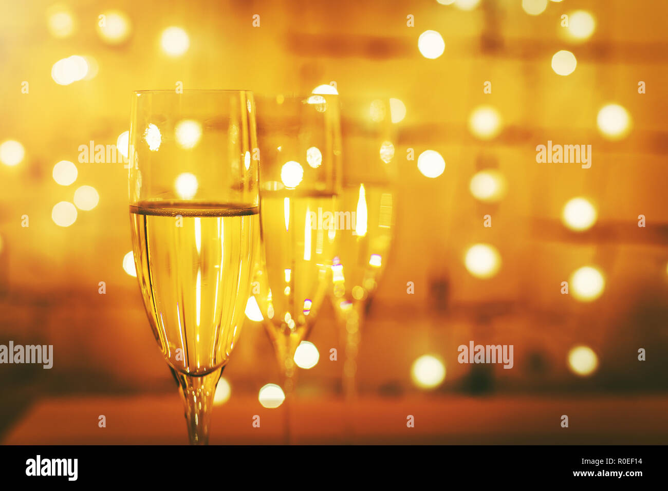 champagne glasses on bokeh lights background Stock Photo