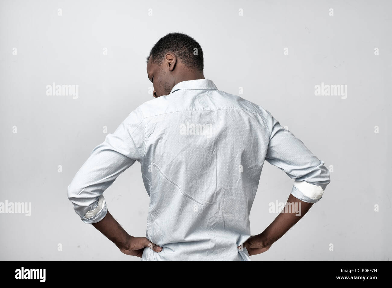 African man in white shirt turning back Stock Photo