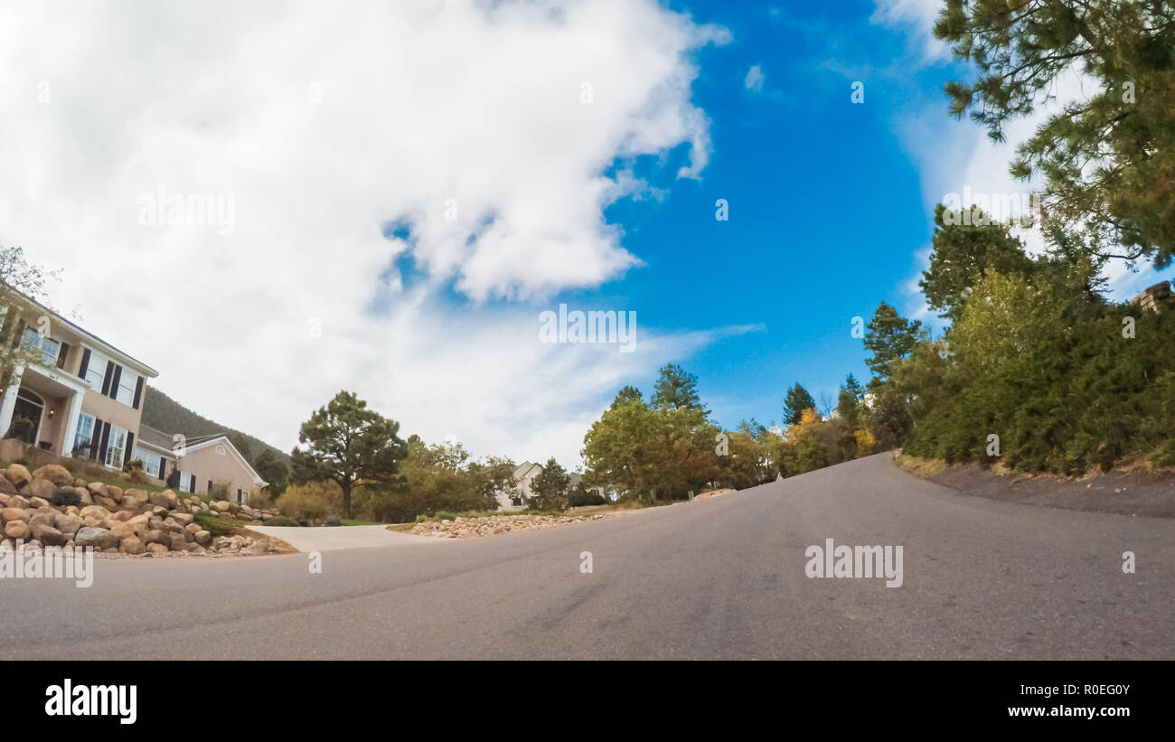 Driving through upscale residential neighborhood of Colorado Springs in Autumn. Stock Photo