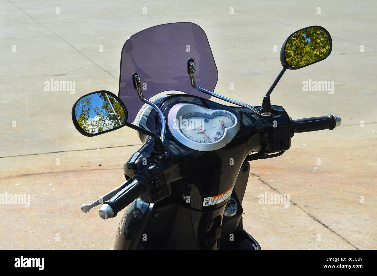 Front moped with steering wheel and mirrors. Clouse up. Stock Photo