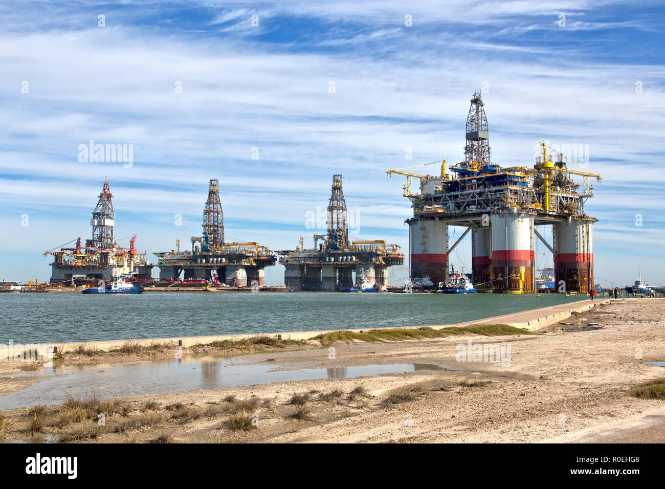 'Big Foot' Chevron's Deep Ocean Platform passing stored Offshore Deep Water Drill Platforms, Port Aransas, Texas. Stock Photo