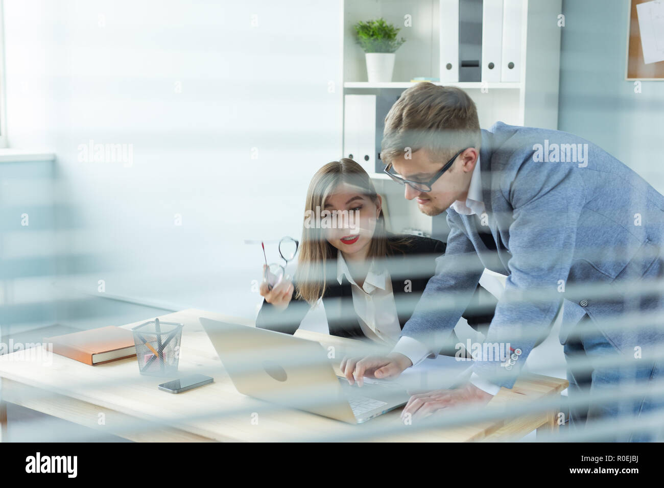 Business and people concept - Portrait of man and woman discussing ...