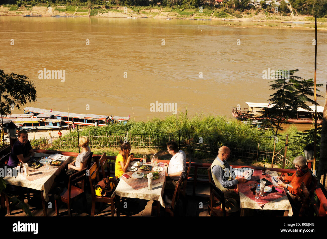 Laos: Nice Restaurant in Luang Prabang city with a wonderfull location at the mekong river. Stock Photo