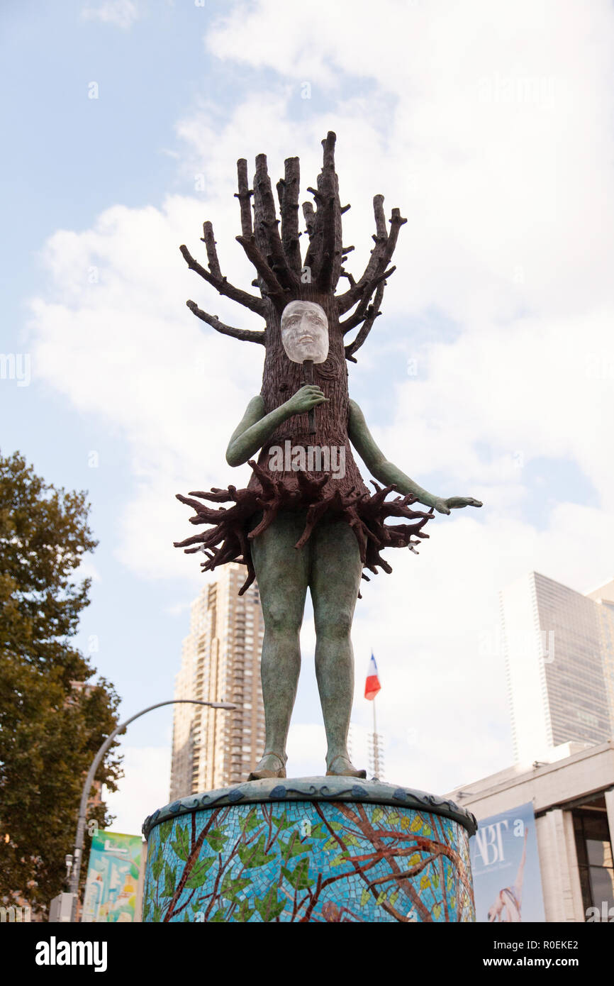 All the World’s a Stage sculpture by Kathy Ruttenberg, a tree person sings atop a pedestal, Dante Park, at 64th Street, New York City, U.S.A. Stock Photo