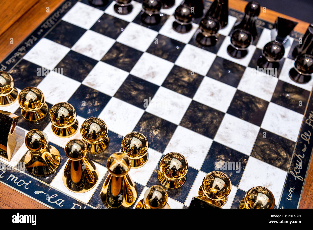 Man Ray chess set with metallic gold and graphite pawns at Frieze Masters 2018, London, UK Stock Photo