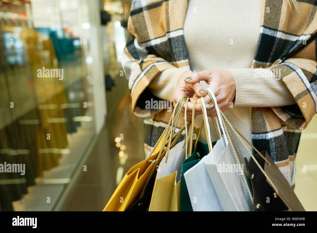 Woman holding shopping bags Stock Photo - Alamy